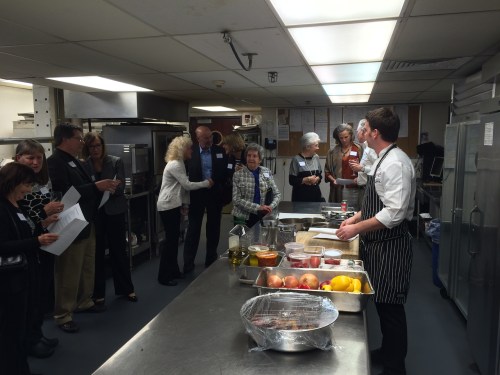 Madison Club’s Chef Andrew Wilson gives a demonstration in preparing trout piperade for Rotarians and their guests.